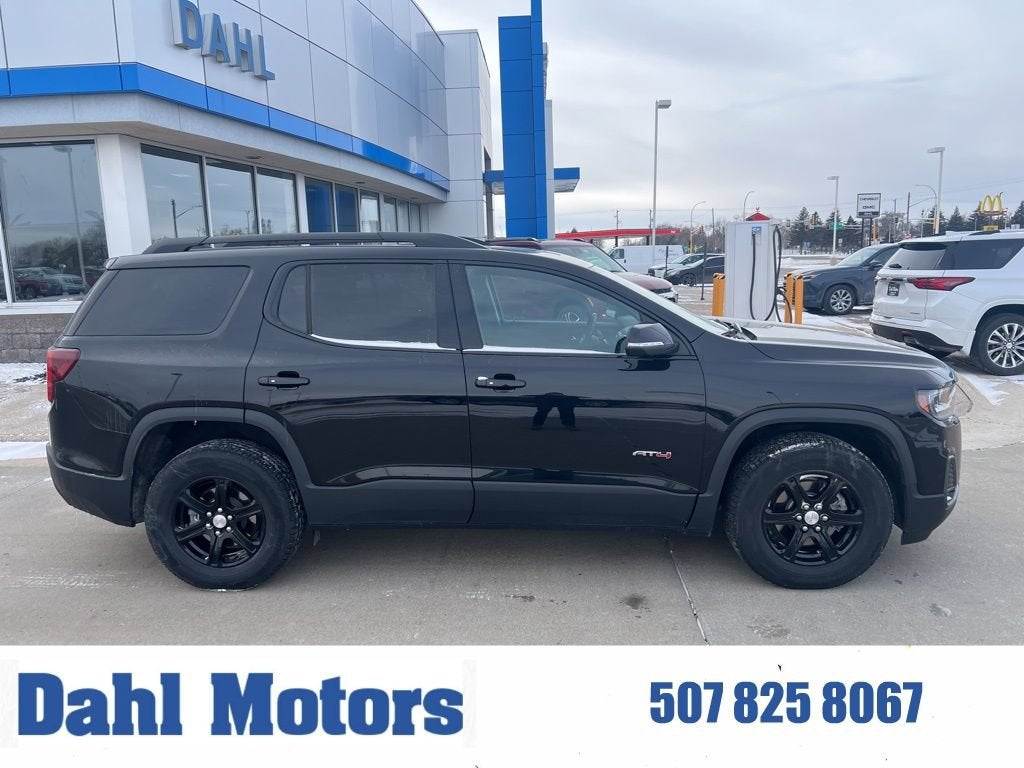 2023 GMC Acadia AT4 in Ebony Twilight Metallic — front three-quarter view