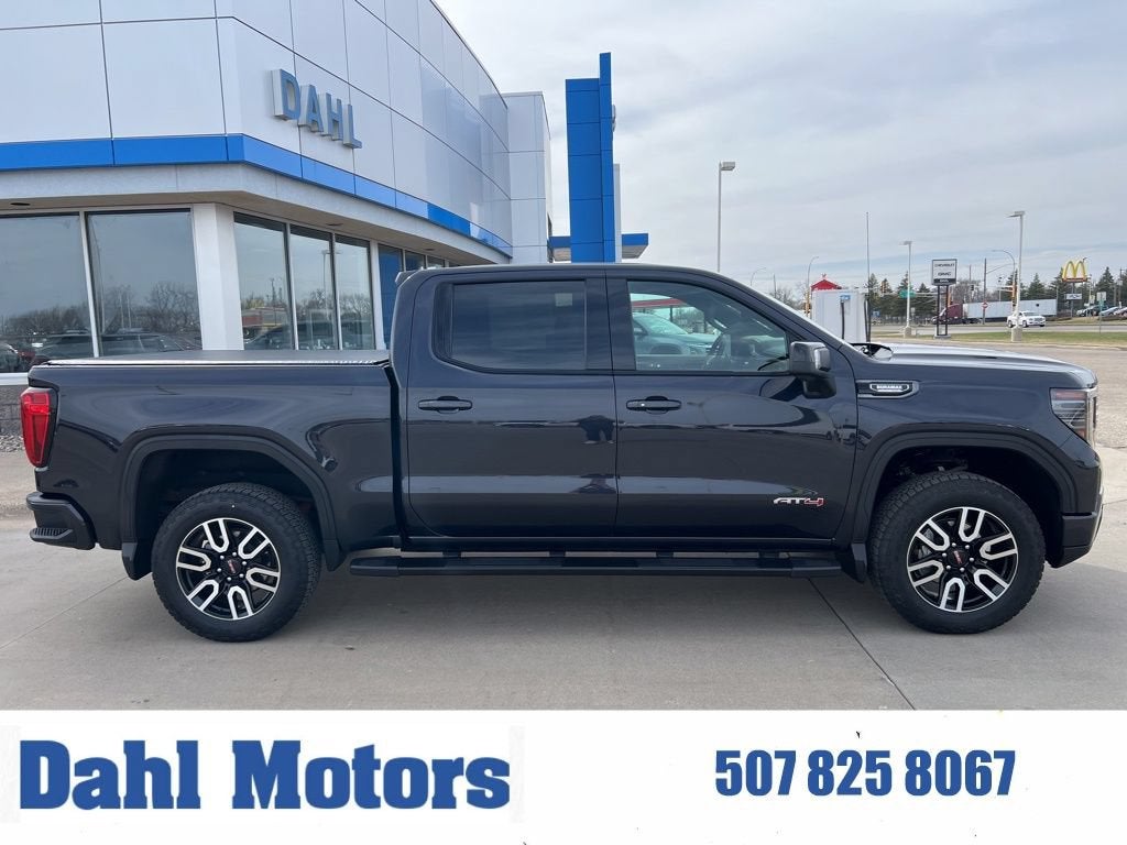2023 GMC Sierra 1500 AT4 in Titanium Rush Metallic — front three-quarter view