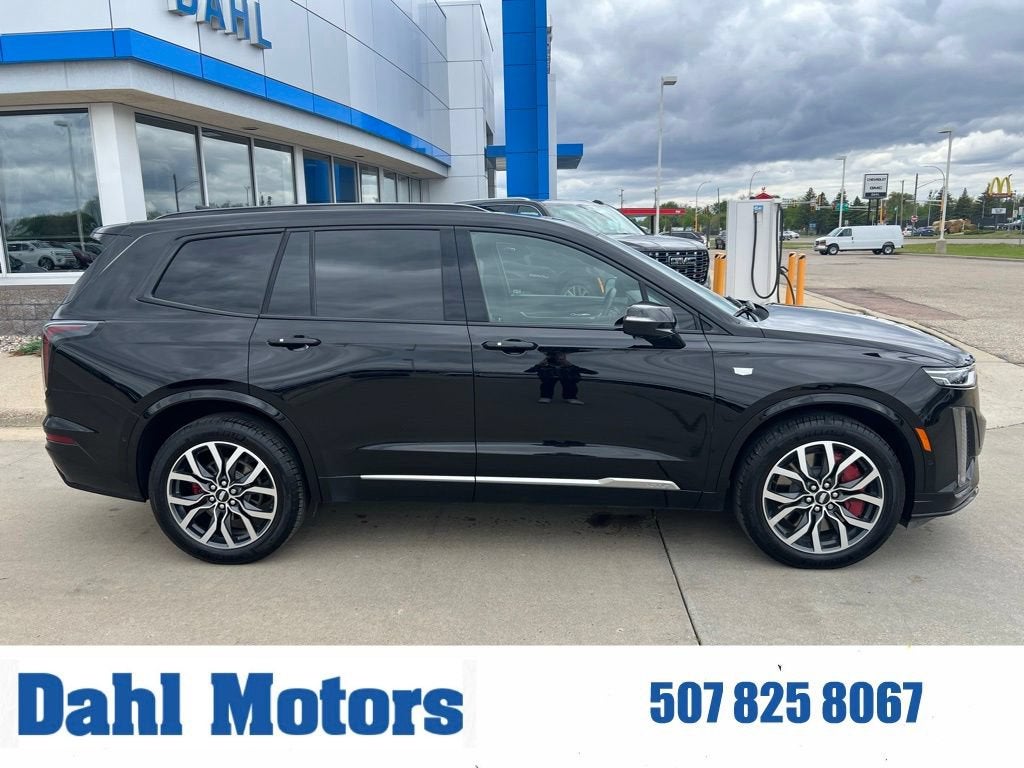 2025 Cadillac XT6 Sport in Stellar Black Metallic — front three-quarter view