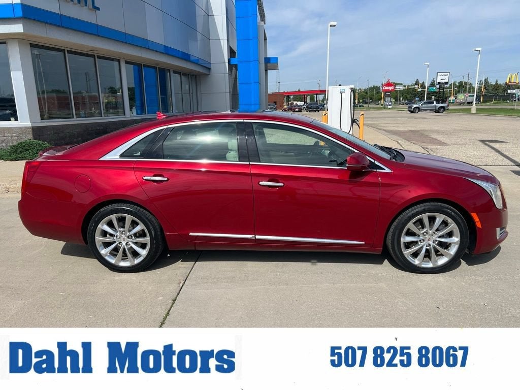 2013 Cadillac XTS Premium in Crystal Red Tintcoat — front three-quarter view
